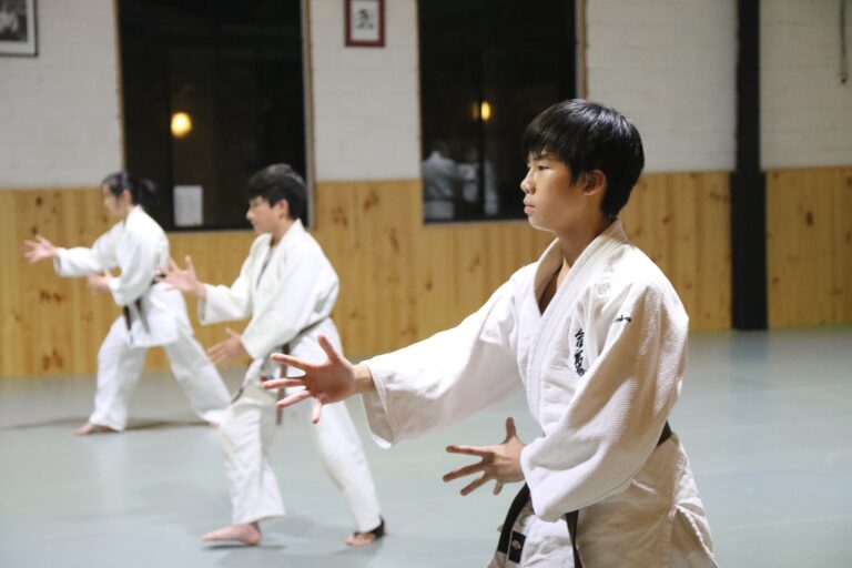 Teens learning focus during traditional martial arts training