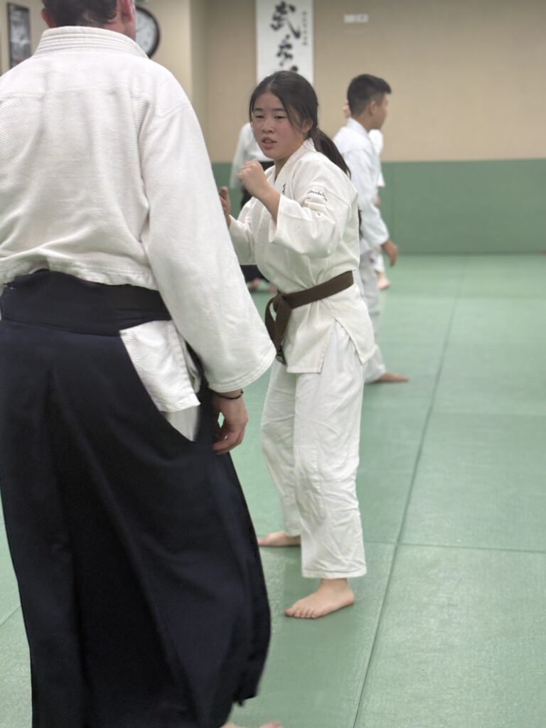 Teenagers practising Aikido self-defence drills
