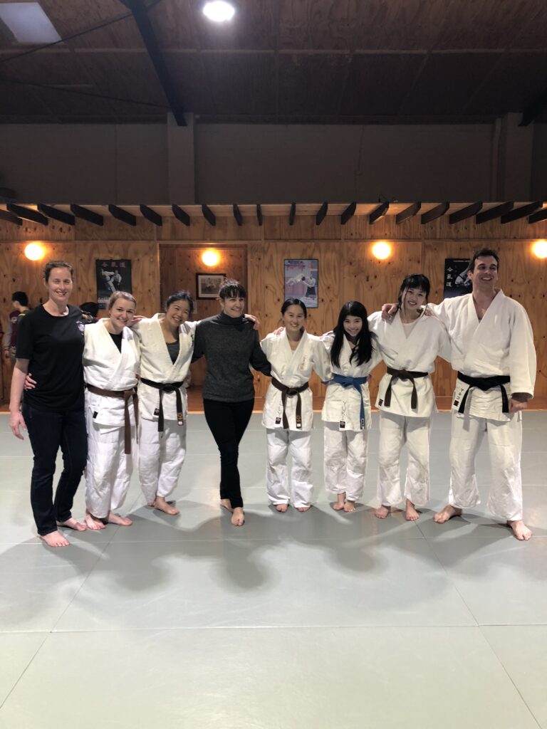 A group of women and girls supporting each other after a self defence class